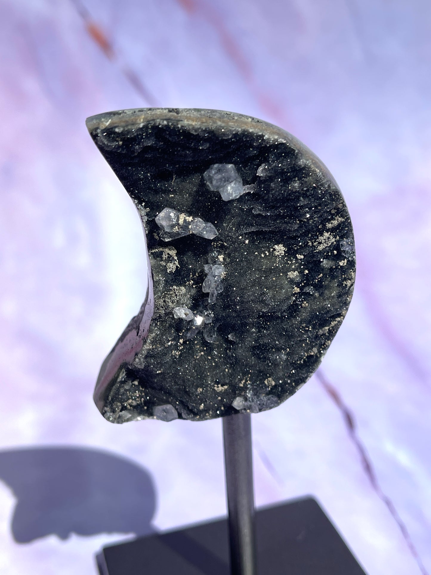 Black moon on a fixed stand